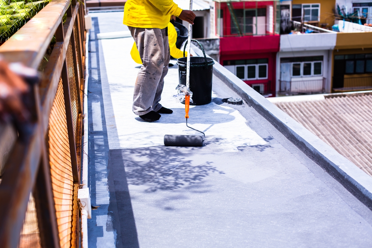 Painted gray flooring on fiber glass with paint rollers for an Antioch, CA business