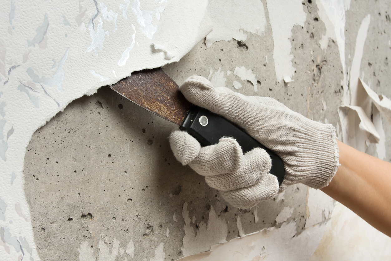 Removing wallpaper from wall from a Lafayette, CA home